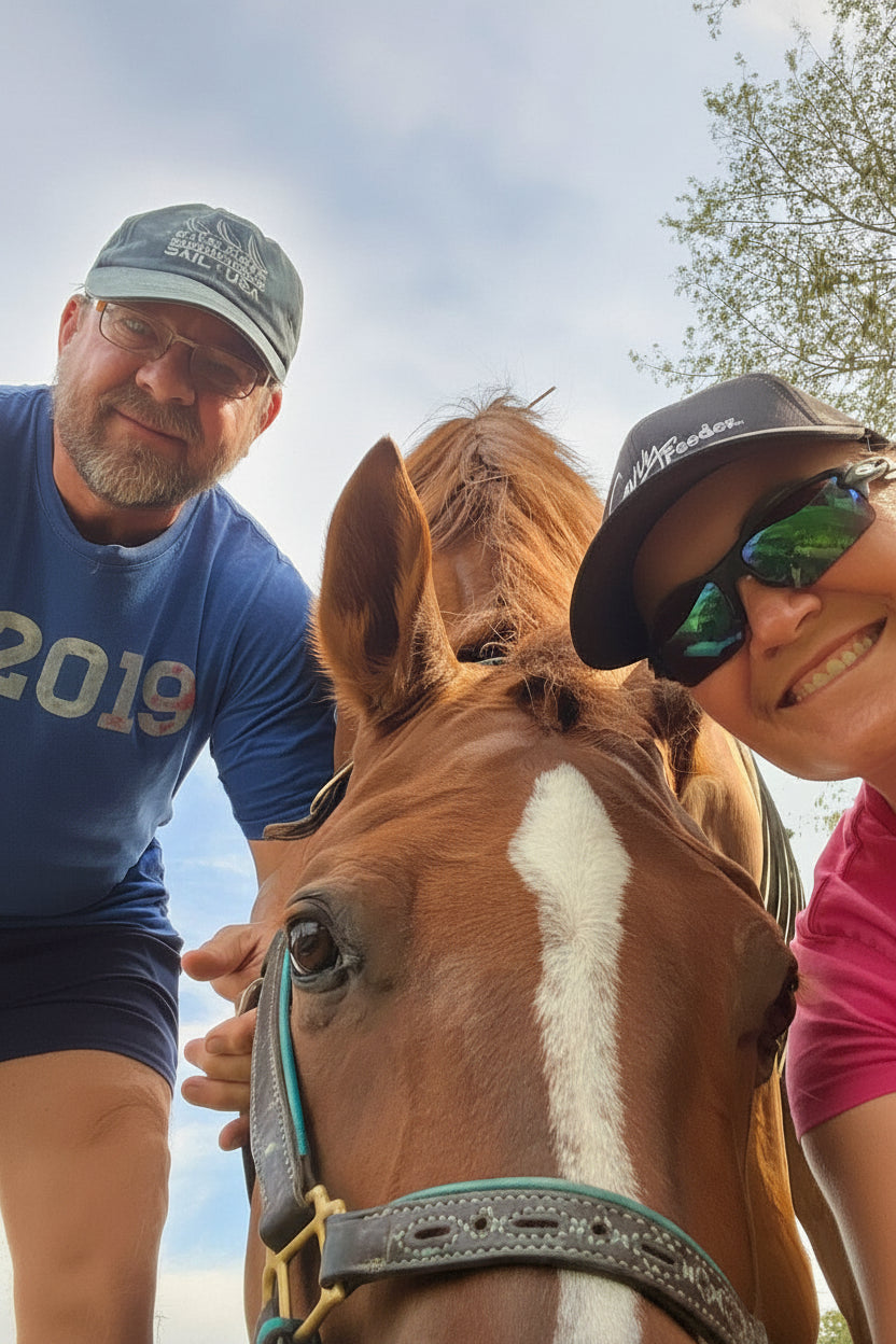 Jen & Lenny Truett taking a selfie with their horse Dreamy outdoors on a clear day.